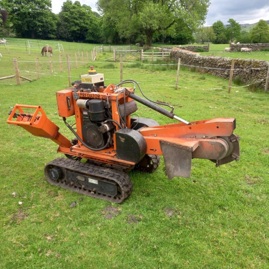 grinding out a tree stump in a horse field 2